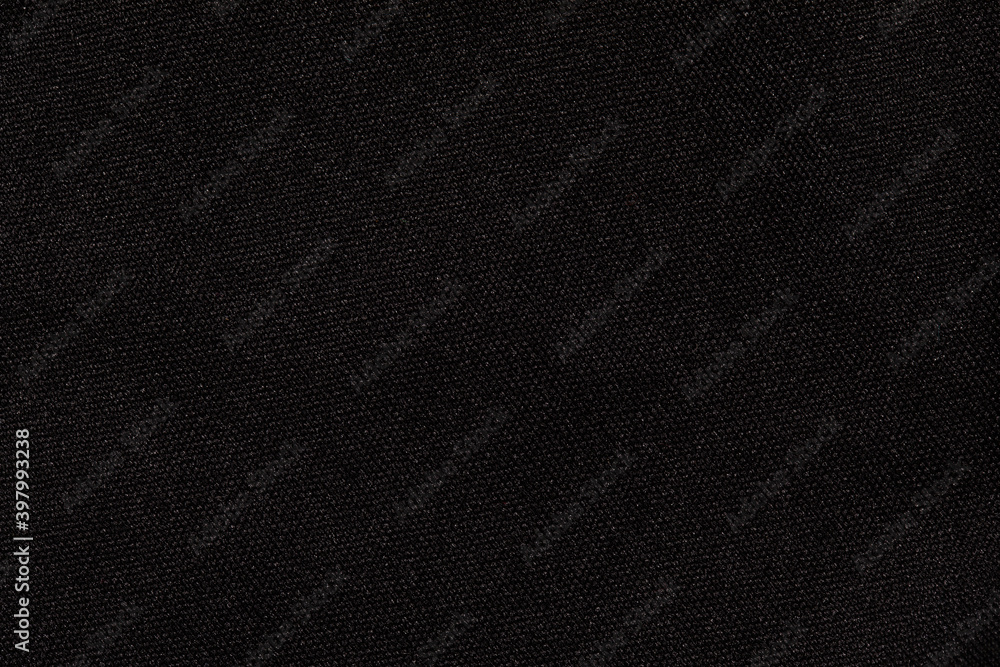 Structure of black fabric as pattern backdrop. Dark grey background from textile material with wicker texture. Structure of black fabric as pattern backdrop. Dark grey background from textile material with wicker texture.