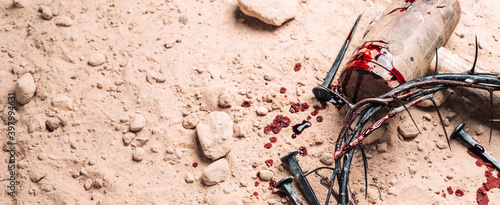Canvas Print Old wooden cross, hammer, bloody nails and crown of thorns on ground