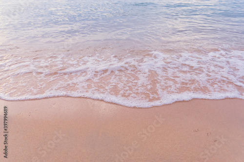 Soft wave of blue ocean on sandy beach