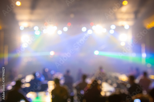 Texture blur and defocus, background for design. Stage light at crowd concert show.