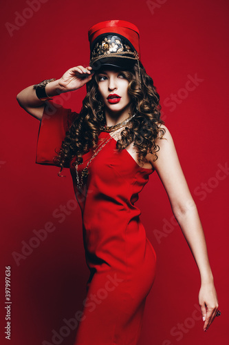 beautiful woman in red dress and red hat