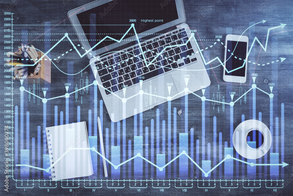 Fototapeta premium Double exposure of forex chart drawing over table background with computer. Concept of financial research and analysis. Top view.