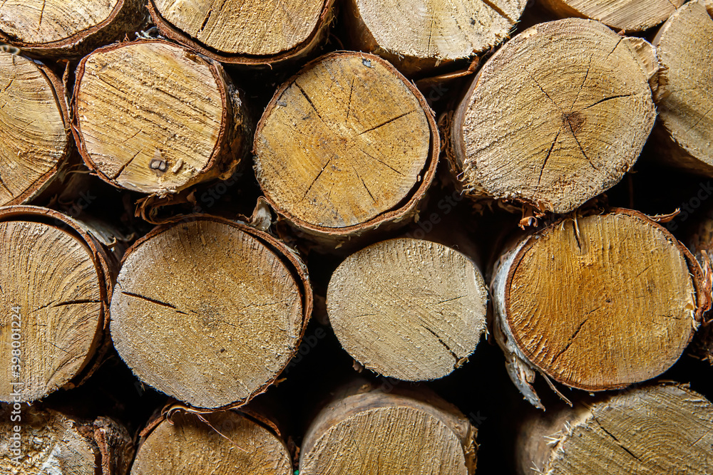 Wood for the stove is in the woodpile close-up. Wood texture Wood for the stove is in the woodpile close-up. Wood texture