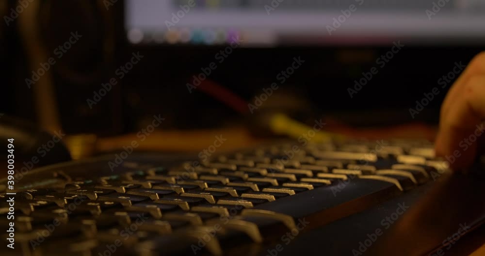 Man with alliance typing on keyboard at his workplace. Man with alliance typing on keyboard at his workplace.