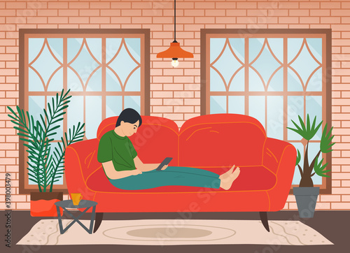 Man sitting on the sofa at home and correspondence surfing the Internet. Male character communicating through network on the tablet. Social media network communication digital gadget addiction