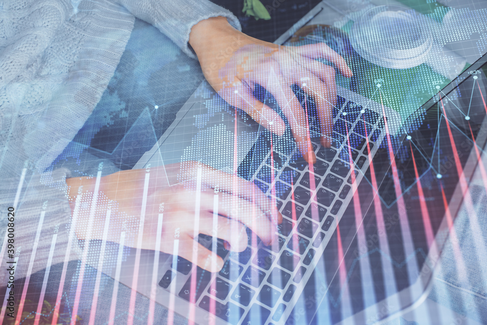 Double exposure of woman hands typing on computer and forex chart hologram drawing. Stock market invest concept. Double exposure of woman hands typing on computer and forex chart hologram drawing. Stock market invest concept.
