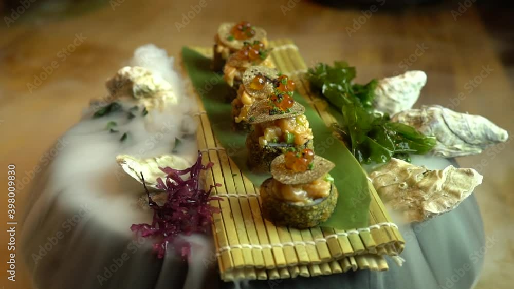 Variety Of Fresh Sushi And Whole Salmon On Ice. Fresh Sushi Assortment, Close-Up On Turntable Variety Of Fresh Sushi And Whole Salmon On Ice. Fresh Sushi Assortment, Close-Up On Turntable