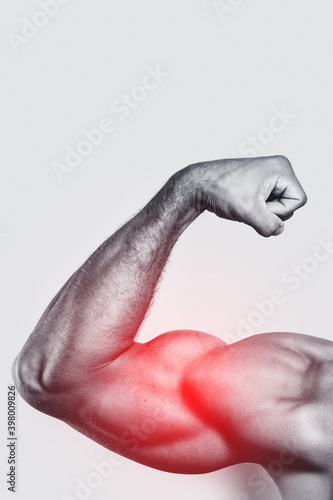 Muscular arm. Specialization for biceps training. photo