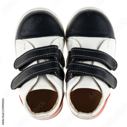 Black and white baby sneakers isolated on white background.