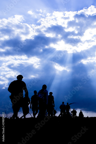 Silhouette of the emigrants on the way