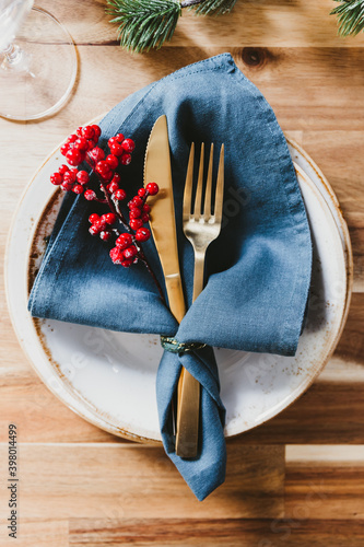 .Festive table setting with winter decor. The concept of Thanksgiving or Christmas family dinner.