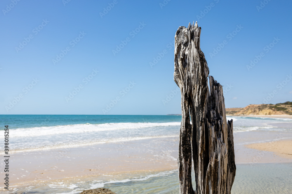 The eroded jetty post with the beach selectively blurred at Port Willunga South Australia on December 8th 2020