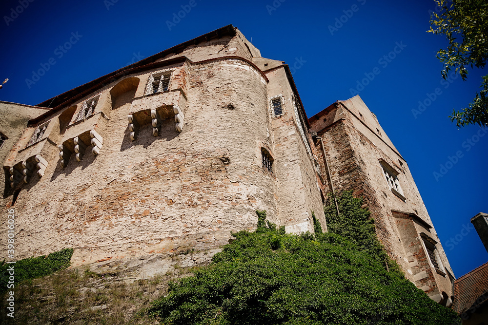 Gothic imposing historic castle Pernstejn at sunny summer day, stronghold on rock above village of Nedvedice, South Moravian Region, Czech Republic