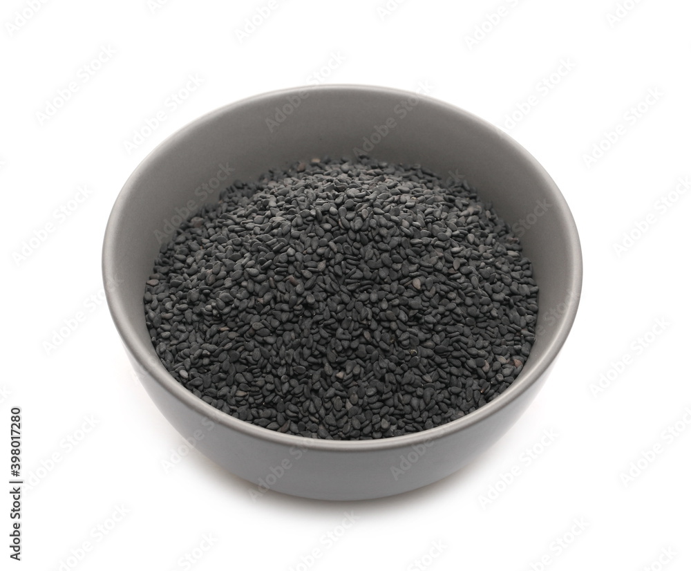 Black sesame seeds in porcelain bowl isolated on white background Black sesame seeds in porcelain bowl isolated on white background