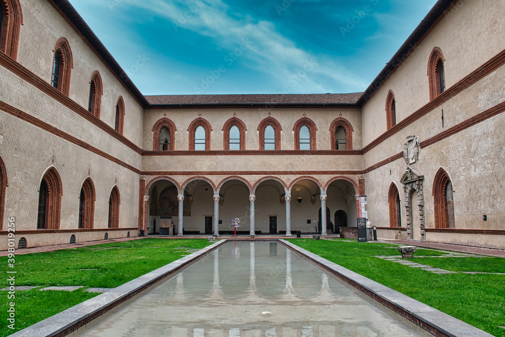 A small inside garden with an artificial lake in the magnificent Sforza Castle , Castello Sforzesco in Milan