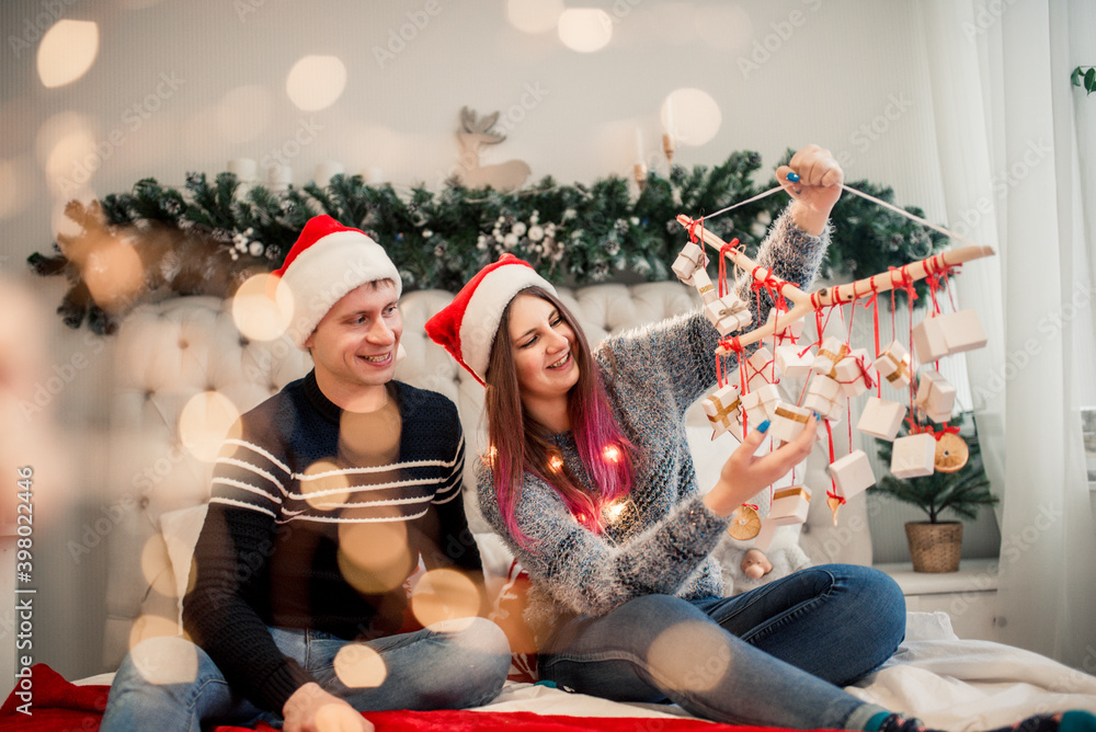 Couple Wrapping Christmas Gifts At Home.Christmas craft box Couple Wrapping Christmas Gifts At Home.Christmas craft box