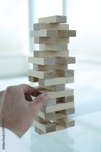 Wood Jenga on glass table