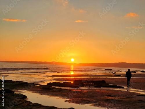 sunset on the beach © Tam