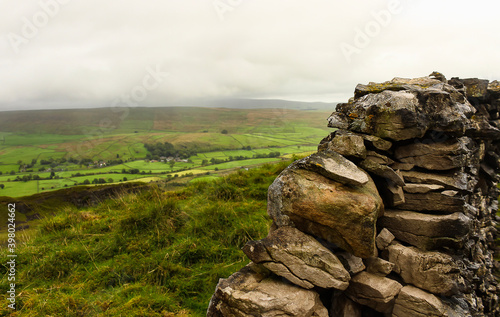 Rocks wall, and green hills farm. English countryside. © traveltofreedom