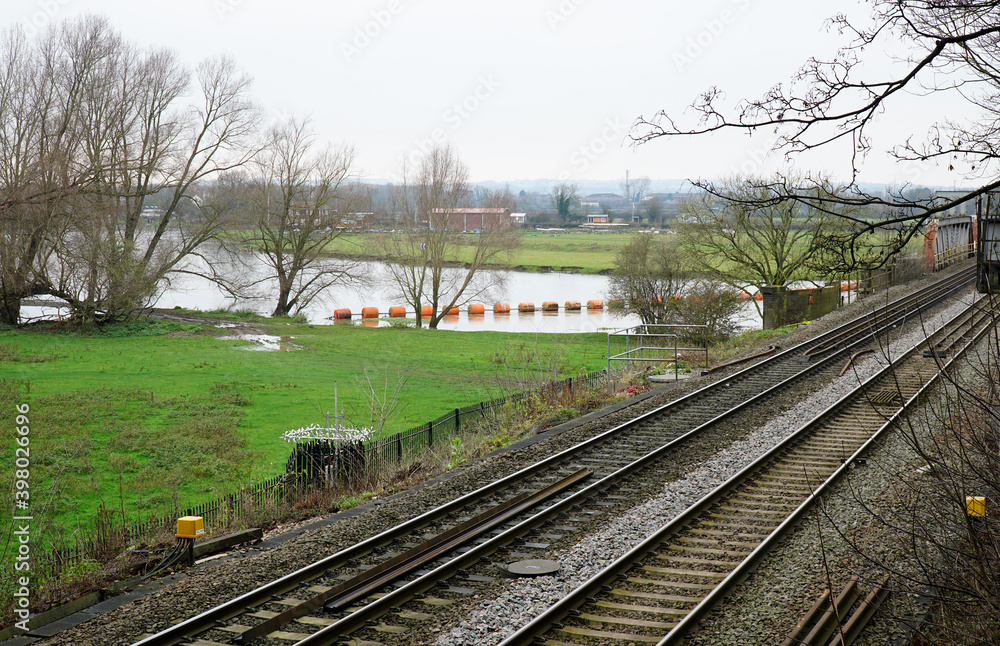 Railroad and river landscape image