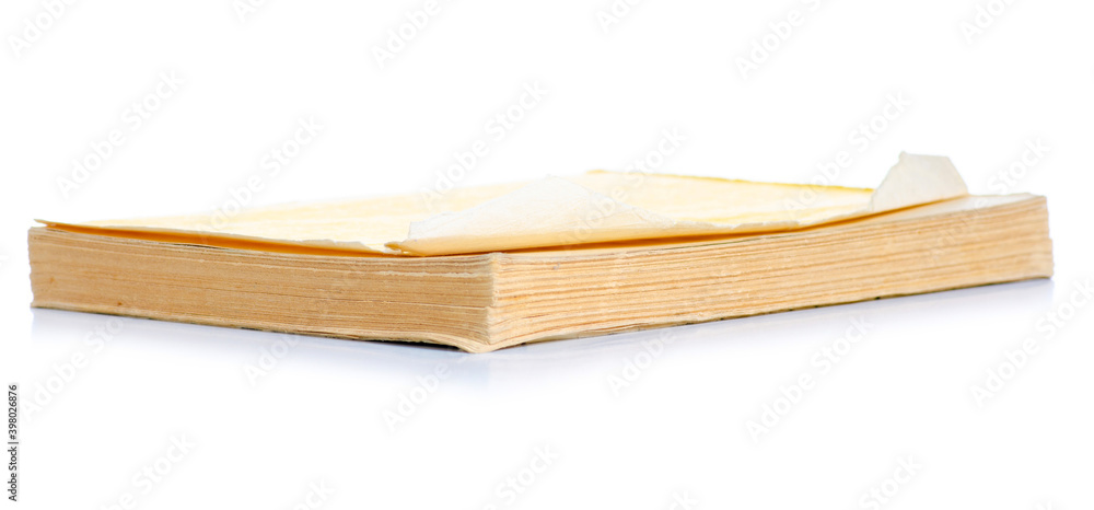Old torn book on white background isolation