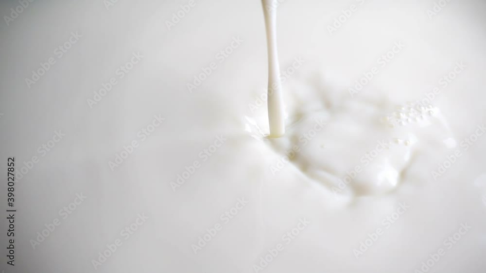 Pouring fresh milk in super slow motion Pouring fresh milk in super slow motion