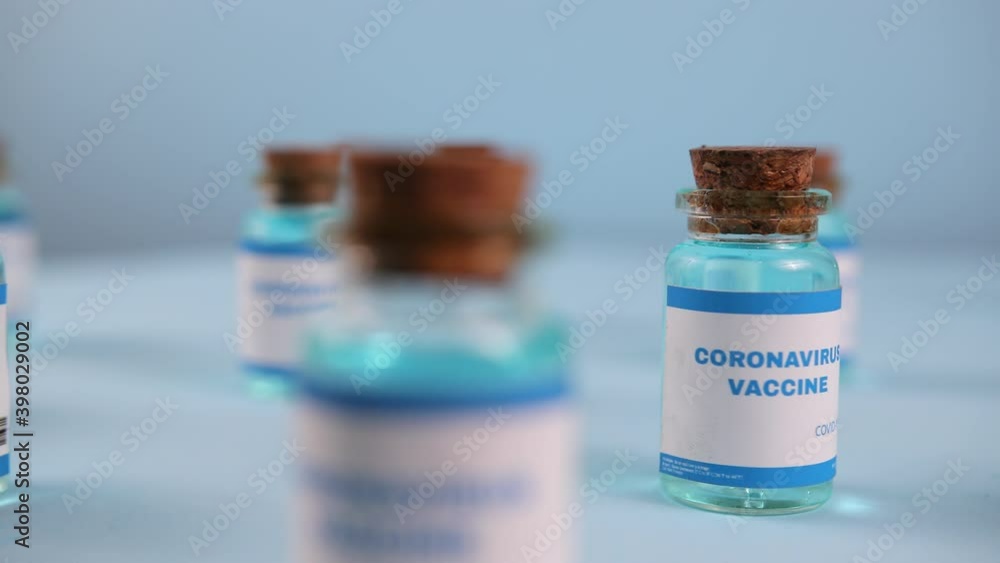 New vaccine pfizer and biontech isolated on blue background. Covid-19, 2019-ncov pandemic. Coronavirus inoculation concept. Sars-cov-2. Ready-made preparations with doses New vaccine pfizer and biontech isolated on blue background. Covid-19, 2019-ncov pandemic. Coronavirus inoculation concept. Sars-cov-2. Ready-made preparations with doses
