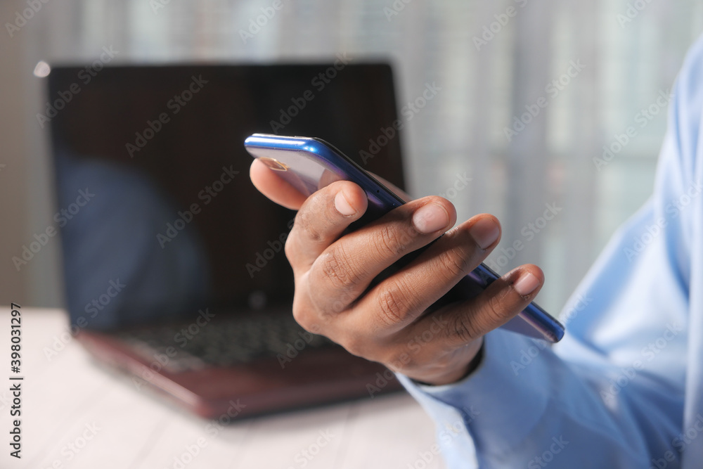 Close up of young man hand using smart phone. Close up of young man hand using smart phone.