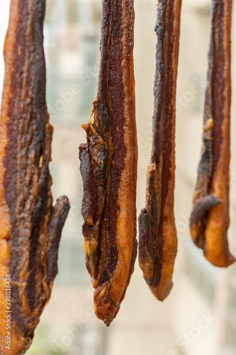 making air-dried bacon in a balcony vertical composition