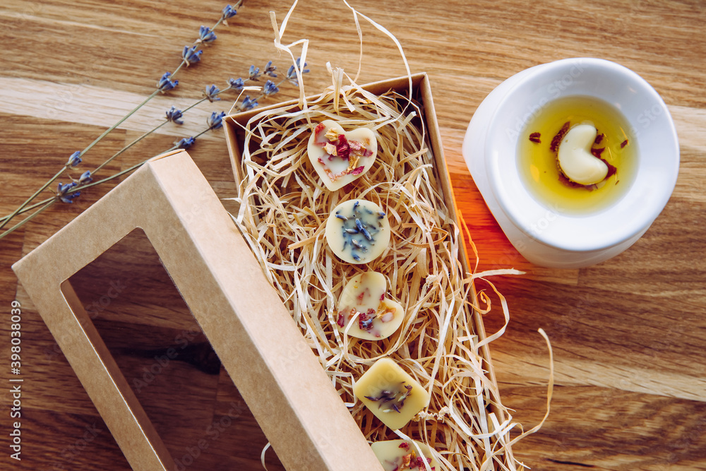 Φωτογραφία All natural homemade gift, scented mini wax melts with dried flower herbs for decoration in cardboard gift box with window and shred wood filler