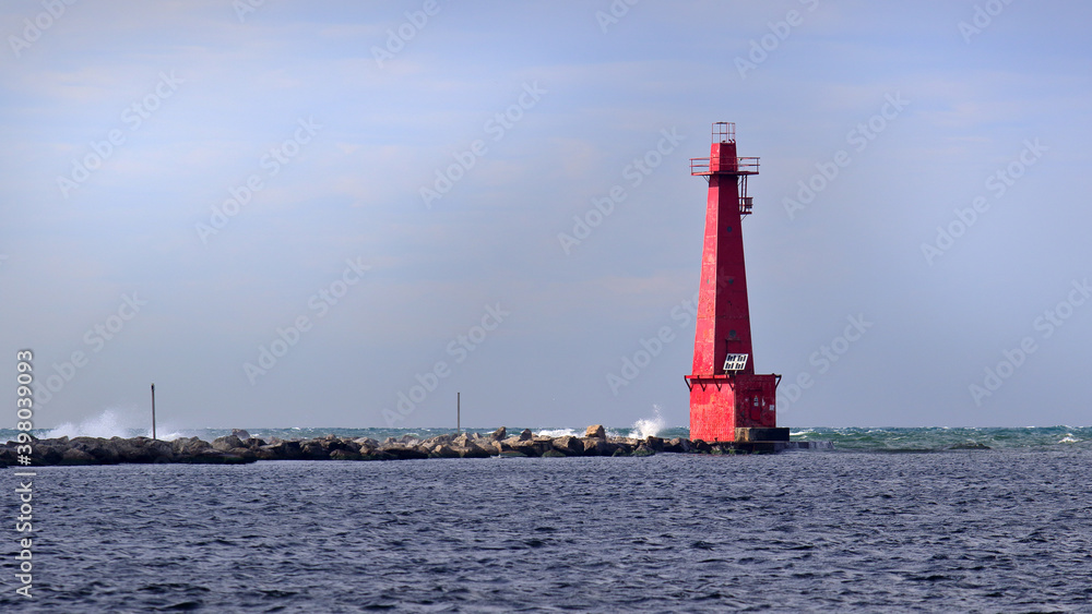 Red lighthouse and breakwater