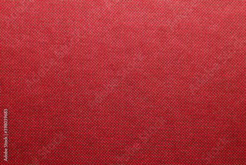 Fabric background in cardinal red. Abstract background with seamless pattern.