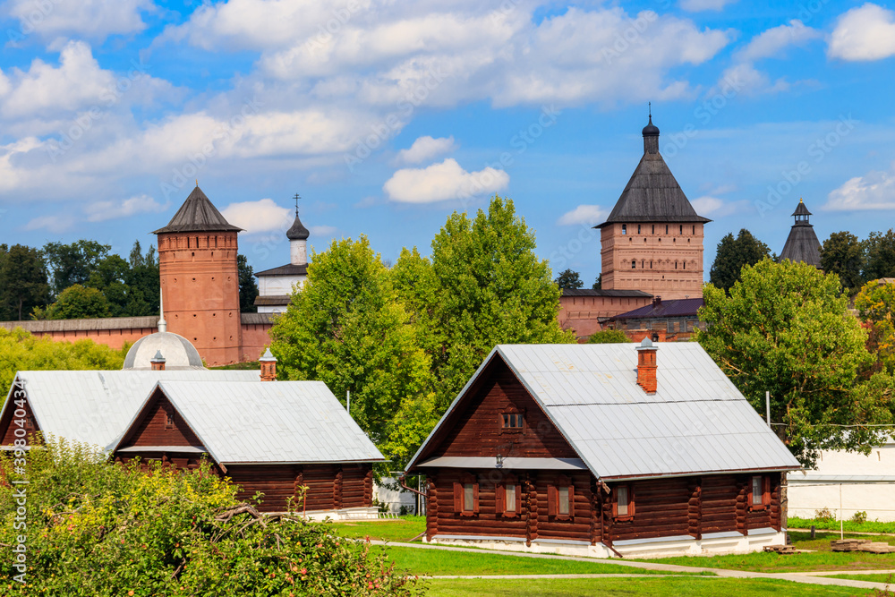 View of Monastery of Saint Euthymius and wooden houses in Suzdal, Russia. Suzdal cityscape View of Monastery of Saint Euthymius and wooden houses in Suzdal, Russia. Suzdal cityscape