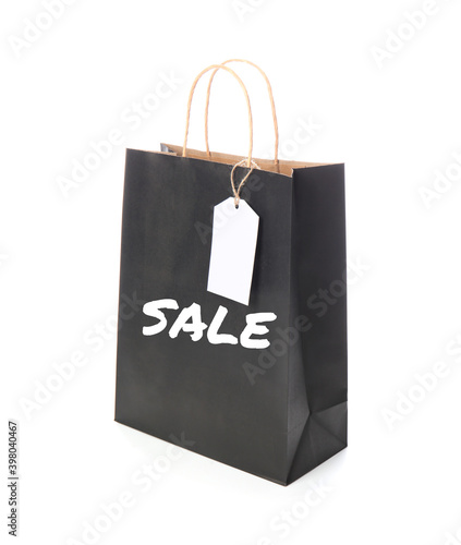 Paper shopping bag with word "Sale" on white background