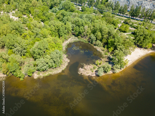 Aerial drone view. River bank on a sunny day.