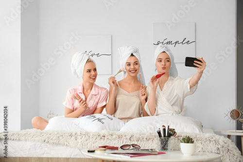 Beautiful young women takin...