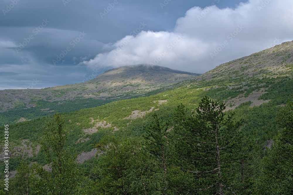 Northern Ural Mountains, Clouds above the spurs of Konzhakovsky Rock Mount and Serebryansky Rock Mount, Russia