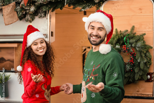 Happy young couple near mot...