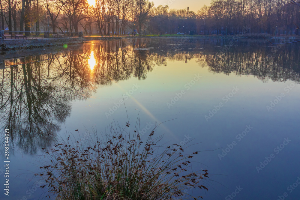 autumn, evening landscape, lake in the park, trees are reflected in the water autumn, evening landscape, lake in the park, trees are reflected in the water