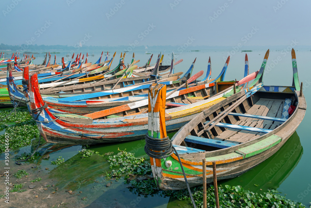 Colorful traditional wooden row boats in Amapura, near U Bein bridge, Mandalay, Burma Myanmar