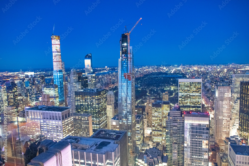 Fototapeta premium Night skyline of Midtown Manhattan, aerial view at night
