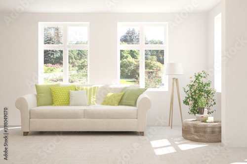 Wallpaper Mural White living room with sofa and summer landscape in window. Scandinavian interior design. 3D illustration Torontodigital.ca