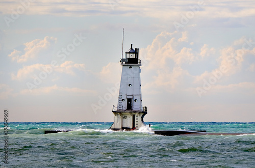 White lighthouse and breakwater