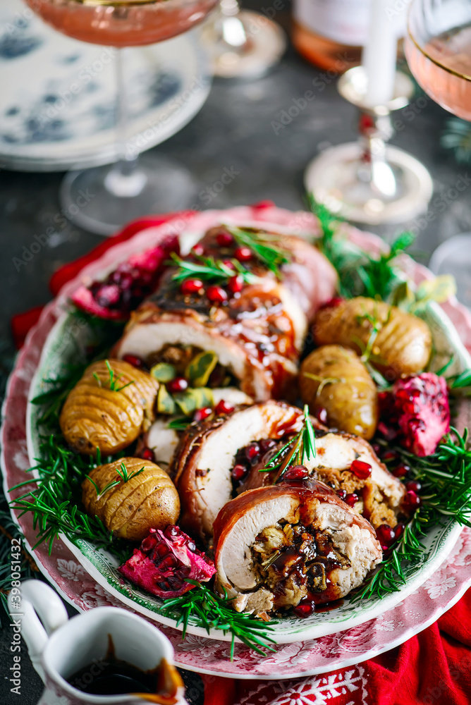 Prosciutto wrapped turkey roulade with pomergranate sauce. .style rustic. Prosciutto wrapped turkey roulade with pomergranate sauce. .style rustic.