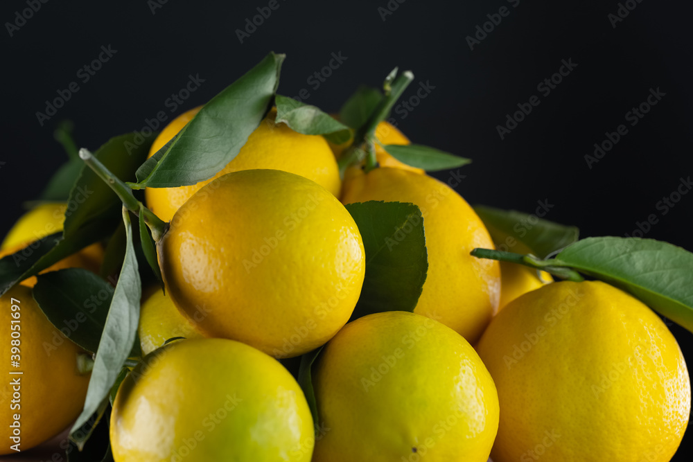 Many lemons on a black background