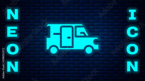 Glowing neon Minibus icon isolated on brick wall background. Vector.