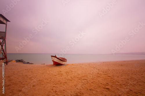 Avcılar on the beach and fishing boats waiting on the sidelines / İstanbul