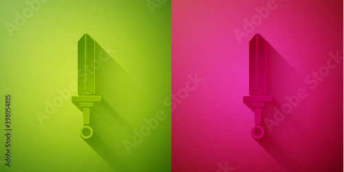 Paper cut Medieval sword icon isolated on green and pink background. Medieval weapon. Paper art style. Vector.