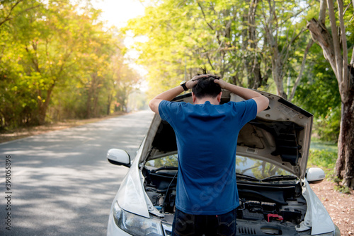 The Asian man was frustrated and angry that the car broke.