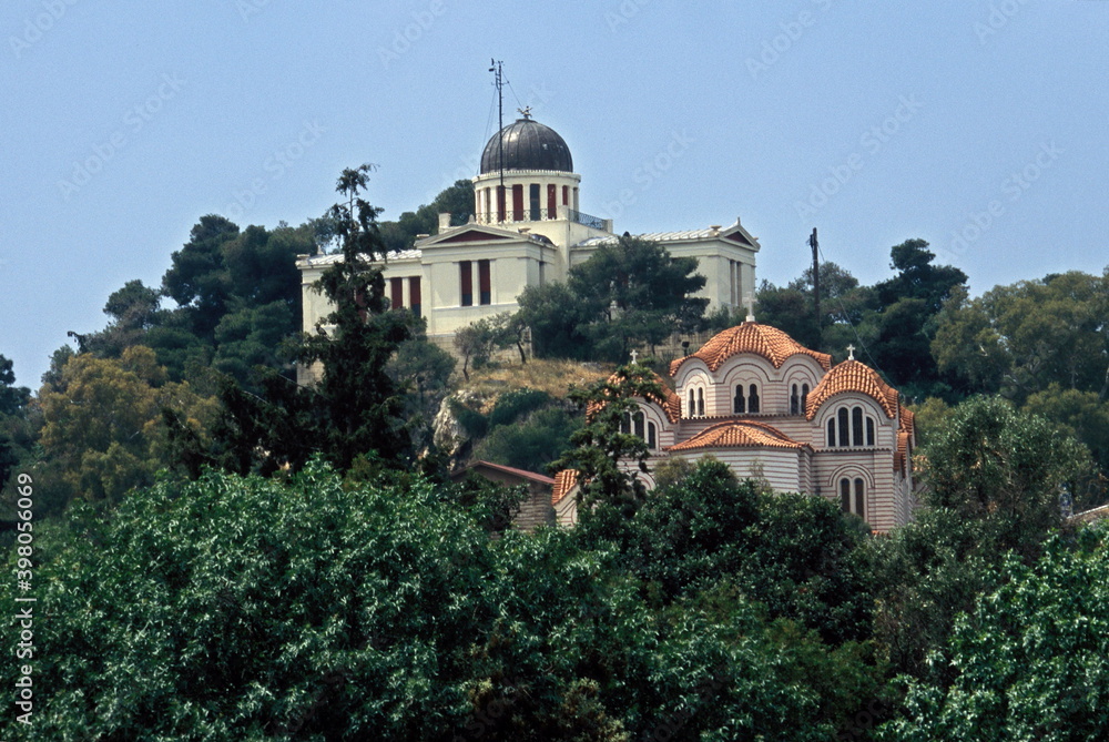 View of National Observatory of Athens and orthodox Church Agia Marina on the Hill of Nymphs in Athens, Greece.